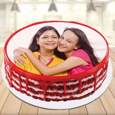 Playful mother and daughter laugh and smile showing cake 19469668 Stock  Photo at Vecteezy